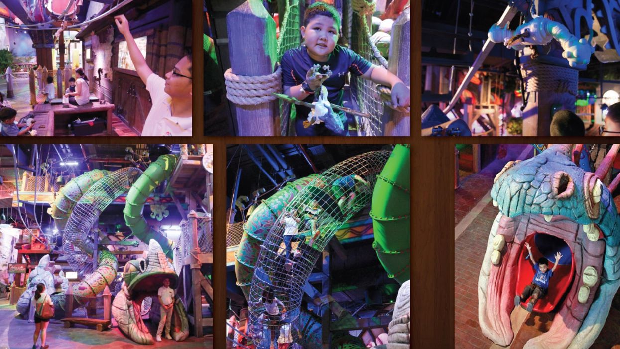 DreamWork DreamPlay Children playing in a colorful indoor playground with slides and climbing structures.