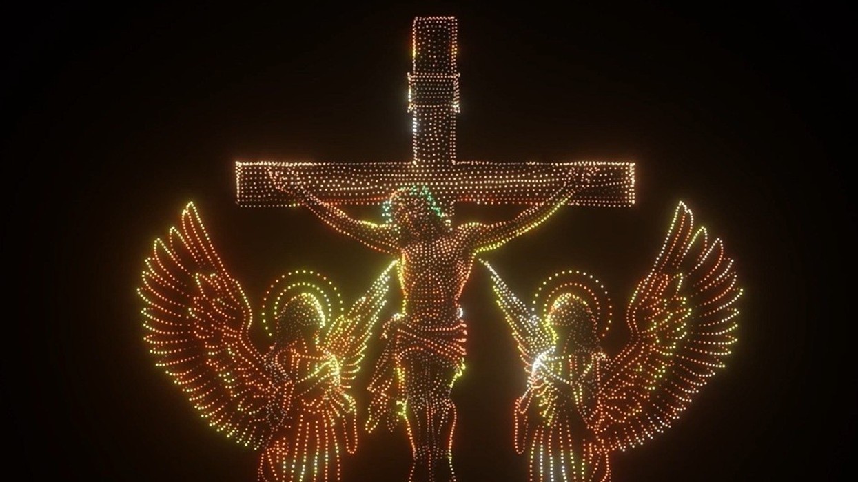Drone depiction of a crucifixion scene with two angels.