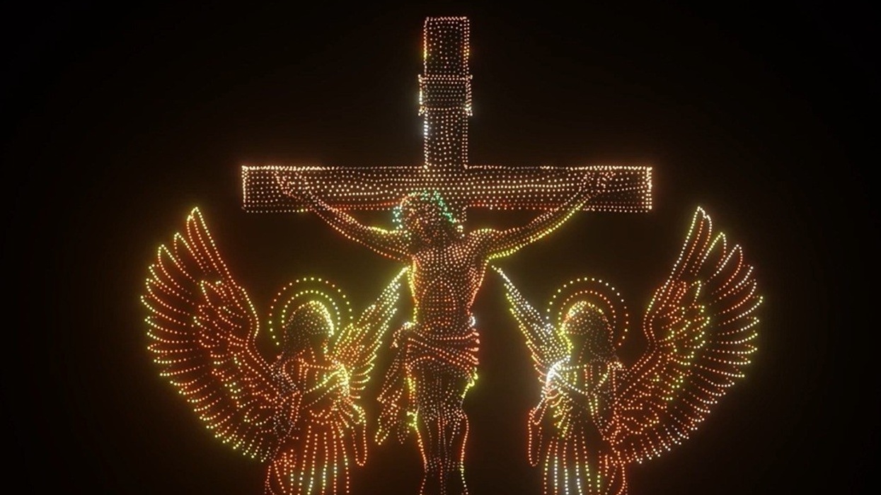 Drone depiction of a crucifixion scene with two angels.