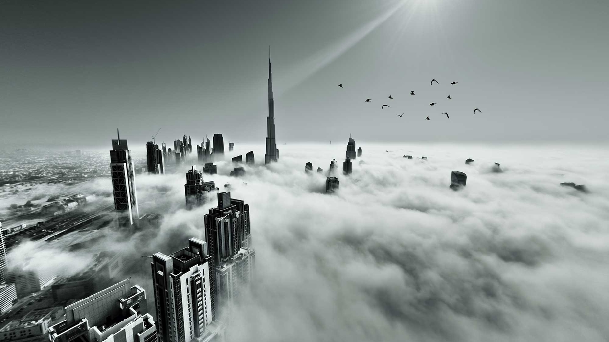 dubai skyline though the clouds from a plane