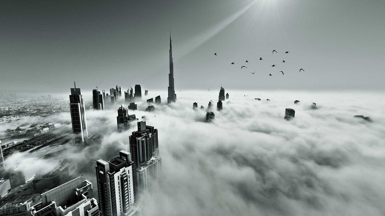 dubai skyline though the clouds from a plane