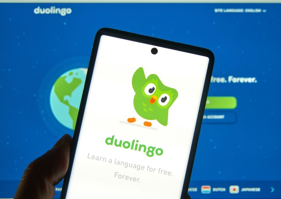 Duolingo logo and application on a cellphone.
