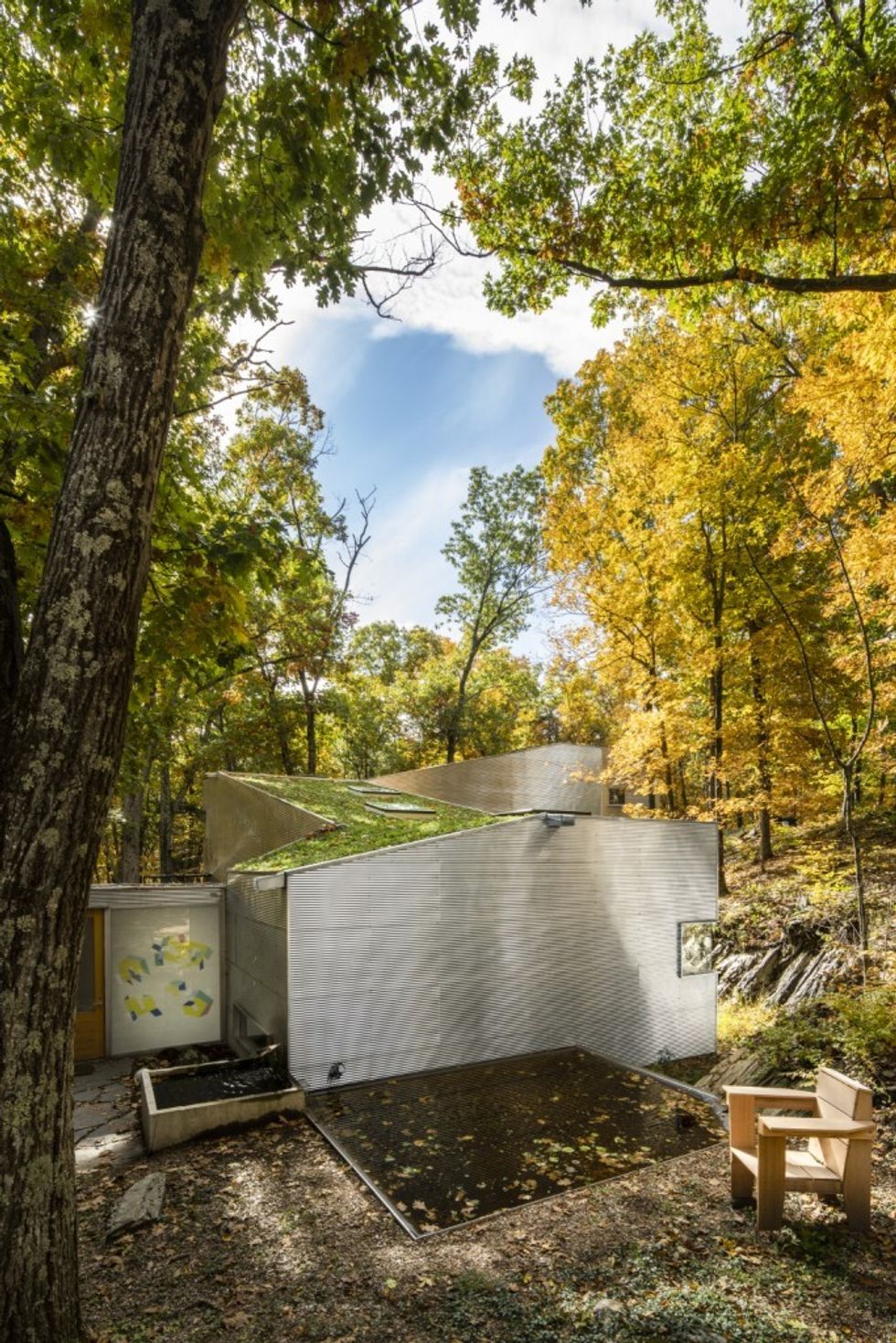 ECP FCI SMHF Archive building exterior with green roof in view, in autumn. Image credit Yoshio Futagawa.