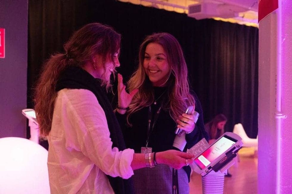 Entertainment Management Conference 2019 female guest scanning her pass on Connect&GO's RFID solution