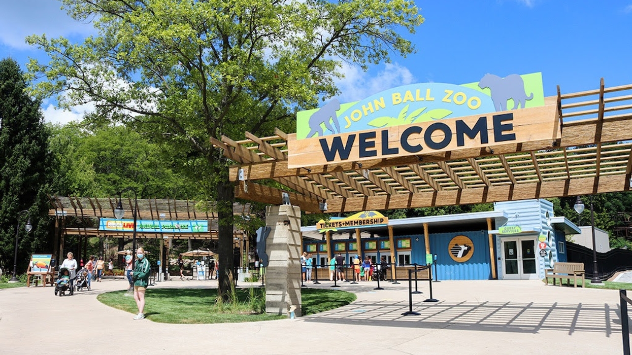 Entrance of John Ball Zoo with welcome sign and ticket booths.