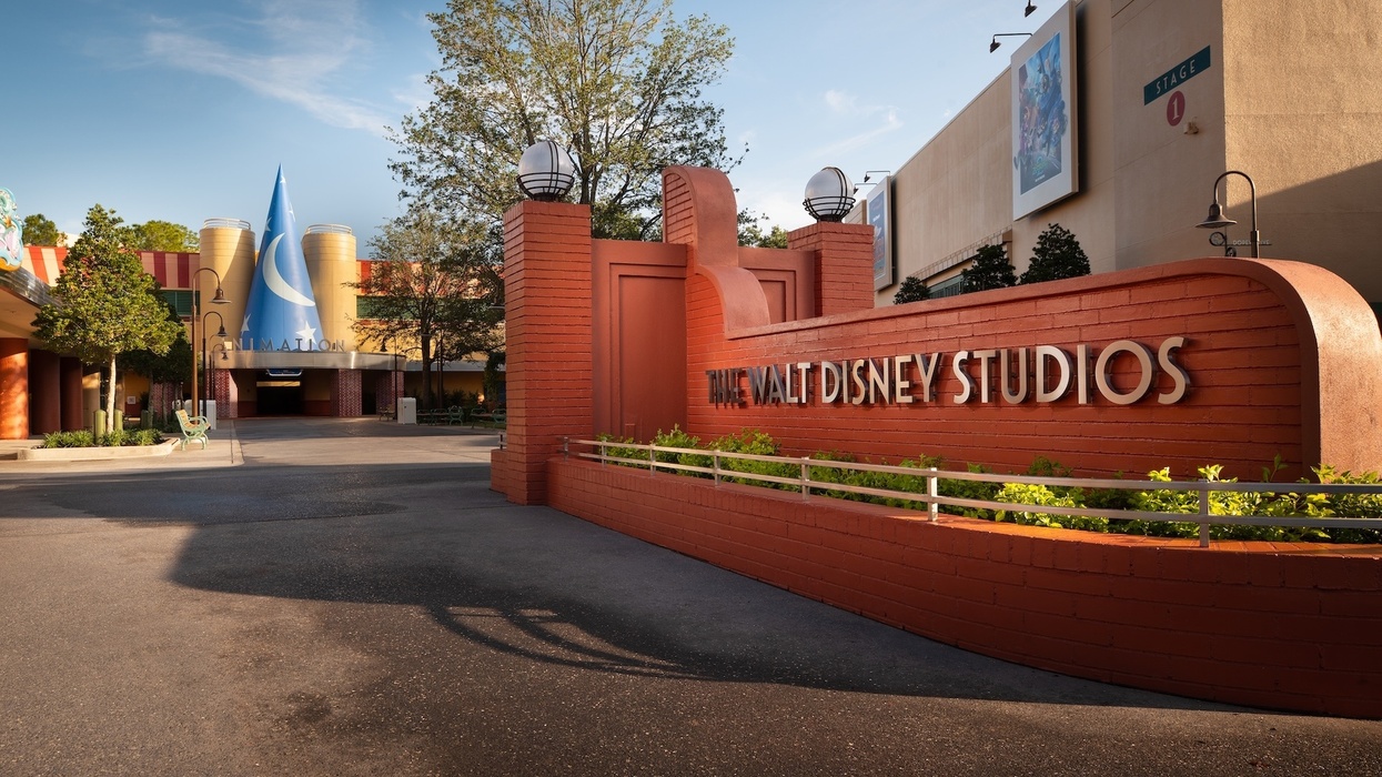 Entrance of The Walt Disney Studios with iconic blue hat and trees at Disney World