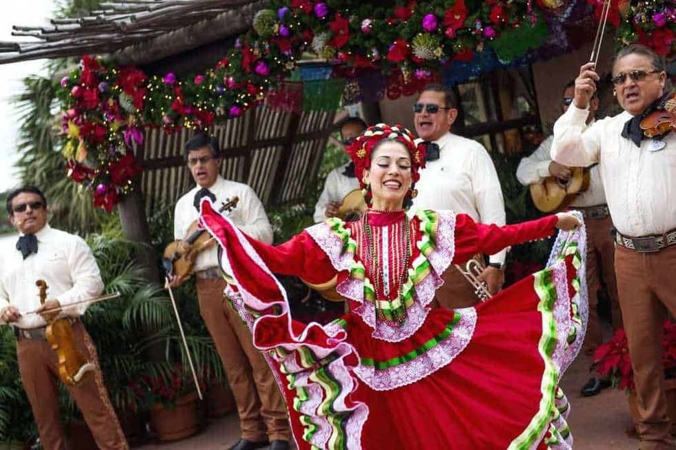 Epcot International Festival of the Holidays Dancer with Mariachi band