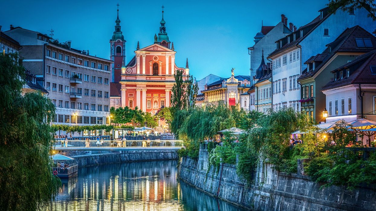 Evening view of the bridge and Ljubljanica river in the city center. Ljubljana, capital of Slovenia.