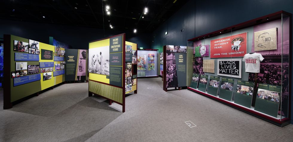 Exhibit showcasing civil rights movements with posters and historical photos.