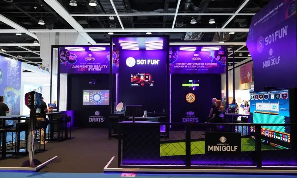 Exhibition booth featuring 501 Fun's augmented reality darts and interactive mini golf.