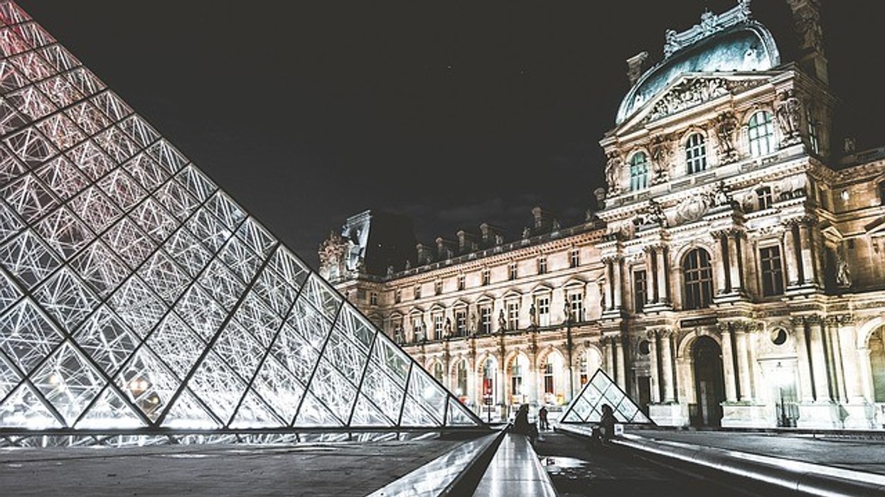 External view of the Louvre Museum, Paris at night.