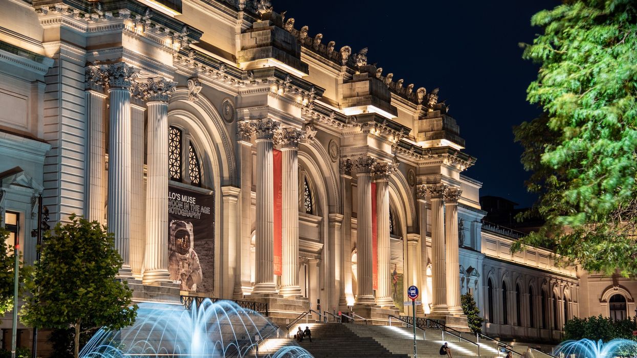 Facade and fountain of the Metropolitan museum of art at night in NYC
