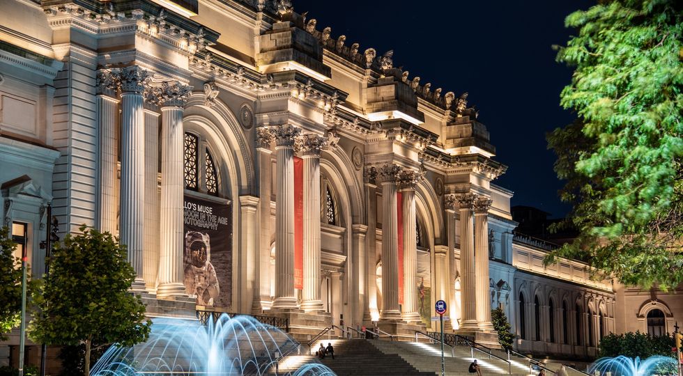Facade and fountain of the Metropolitan museum of art at night in NYC