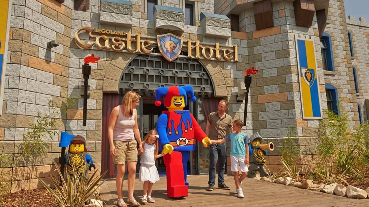 family and jester outside legoland castle hotel themed by scruffy dog