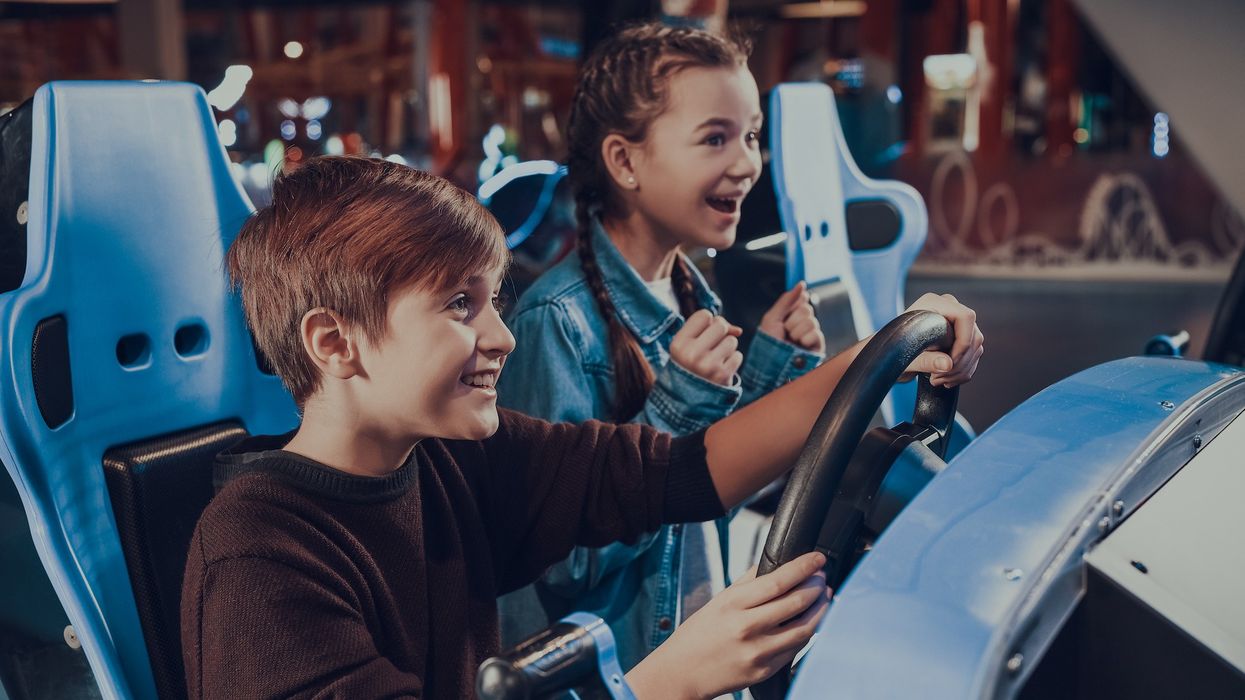 family-at-arcade-driving-game