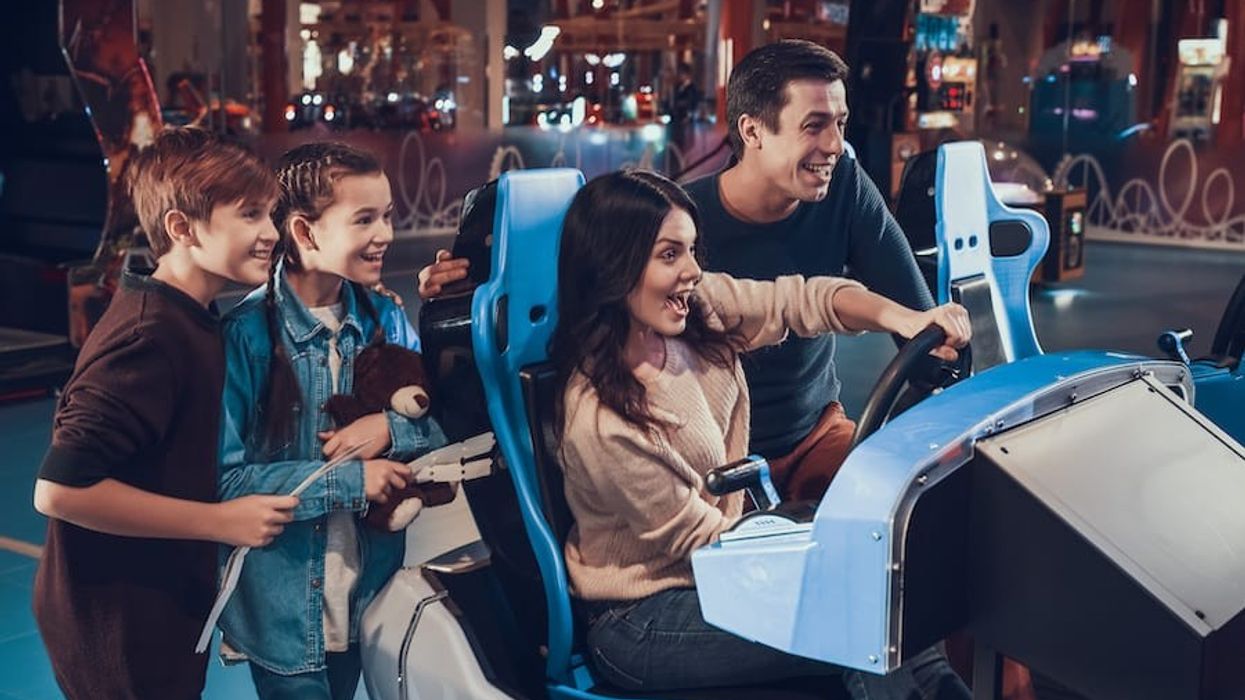 Family-at-arcade planning an entertainment centre