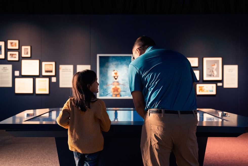 Family at Disney100 exhibition in Munich
