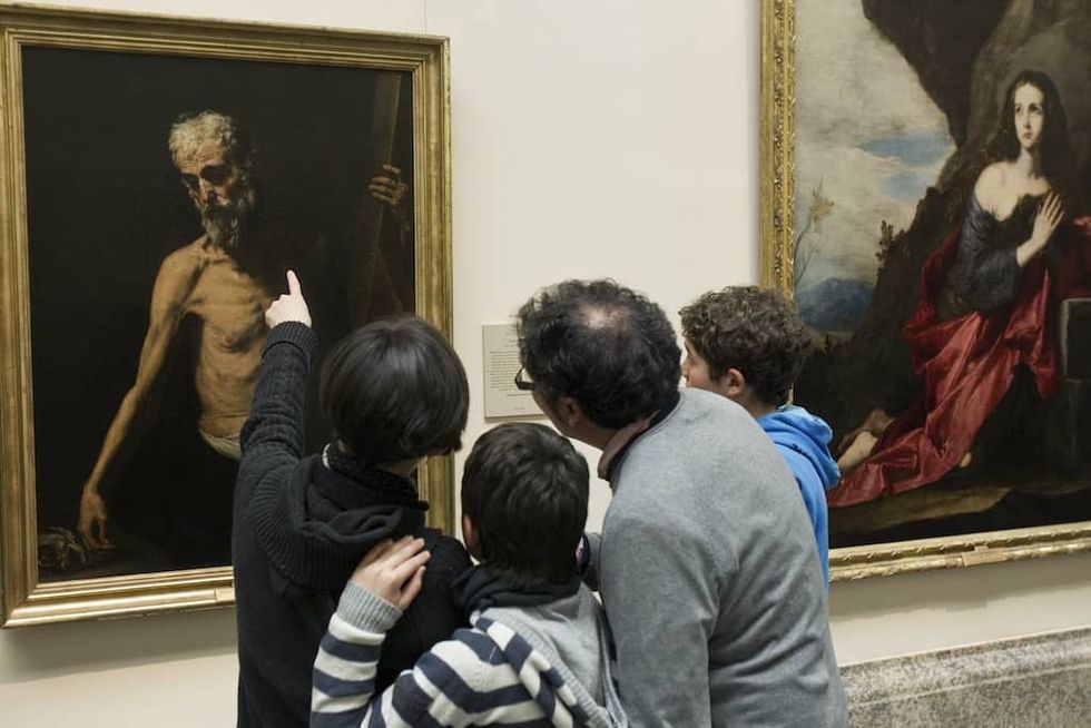 Family look at painting together