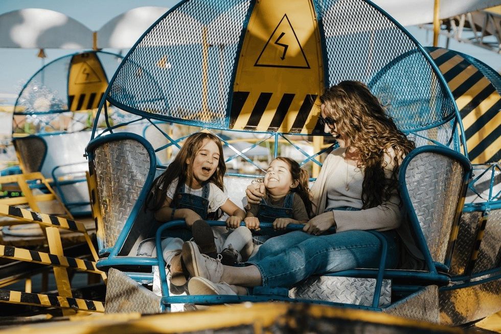 family on spinning ride
