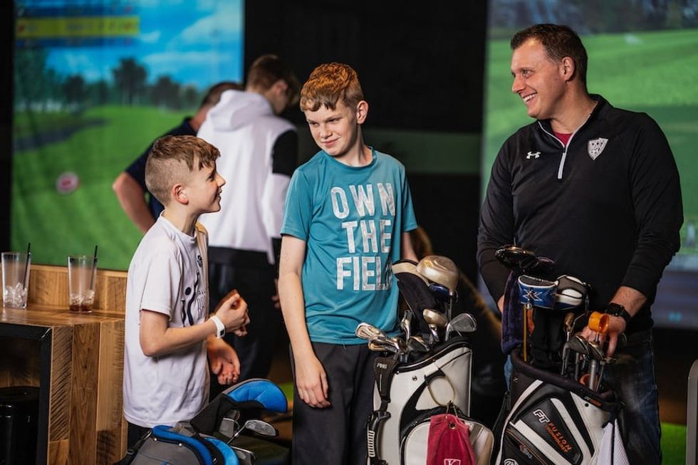 family playing x-golf