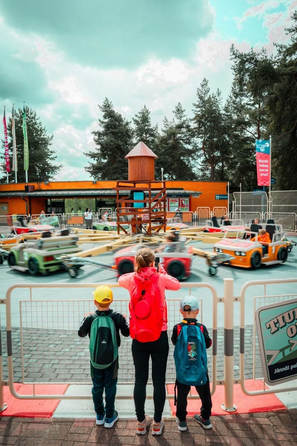 Family watching the Zierer Drifter ride at S\u00e4rk\u00e4nniemi in Finland