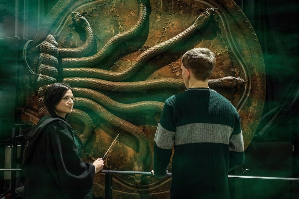 Fans in front of Chamber of Secrets door Warner Bros Studio Tour London