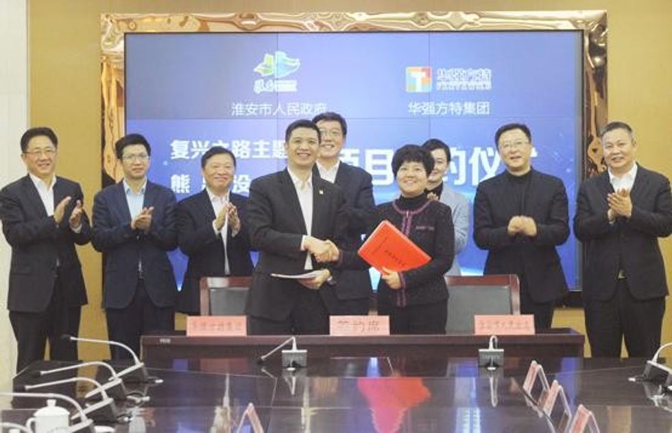 Fantawild executives and Huaian government representatives signing theme park deal