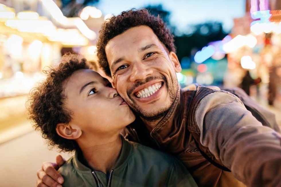 Father-and-son-at-amusement-park