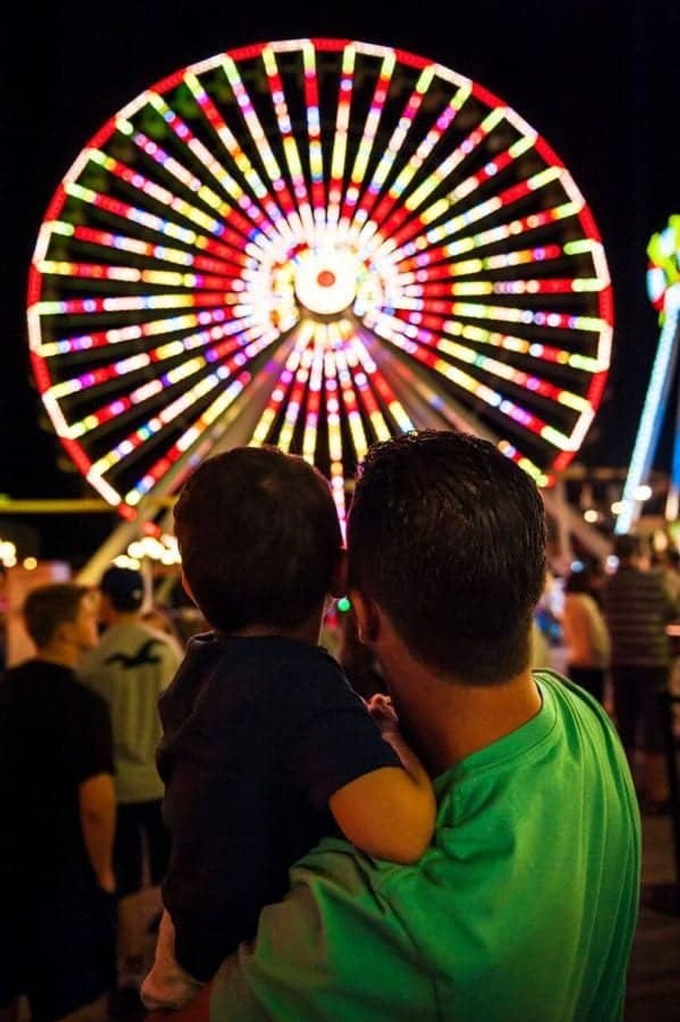 Father and son looking at the Giant Wheel at Morey's Piers