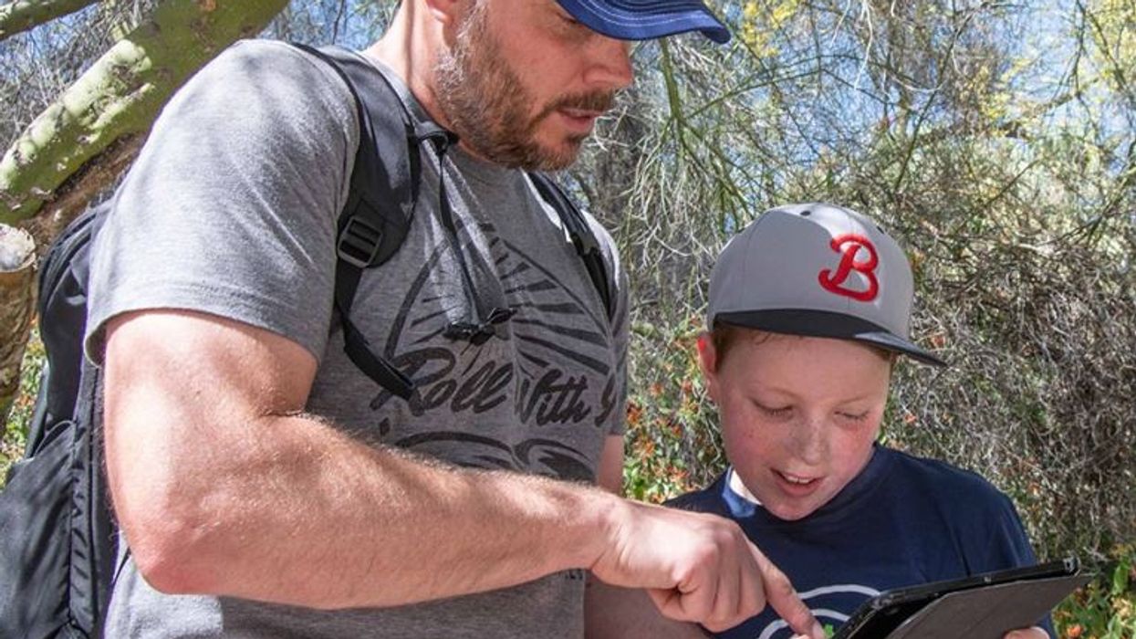 father and son use guru mobile app at Rancho Santa Ana Botanic Garden
