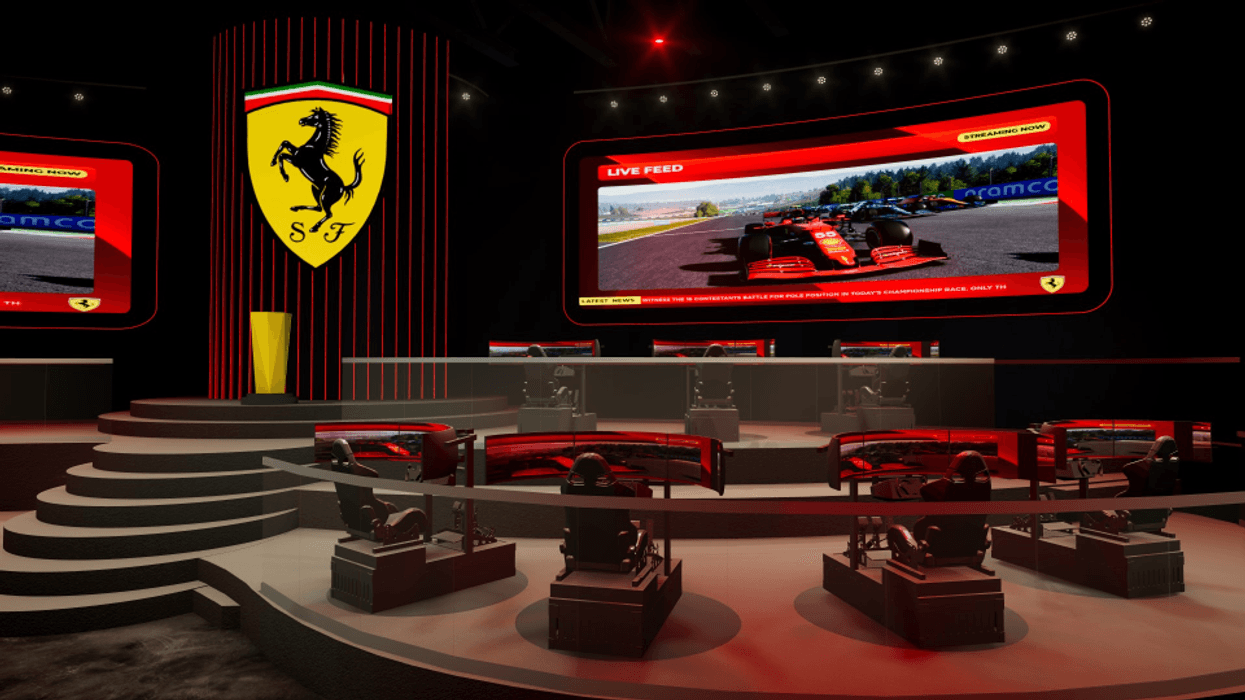 Ferrari-themed gaming setup with racing simulators and large screens displaying a live race.