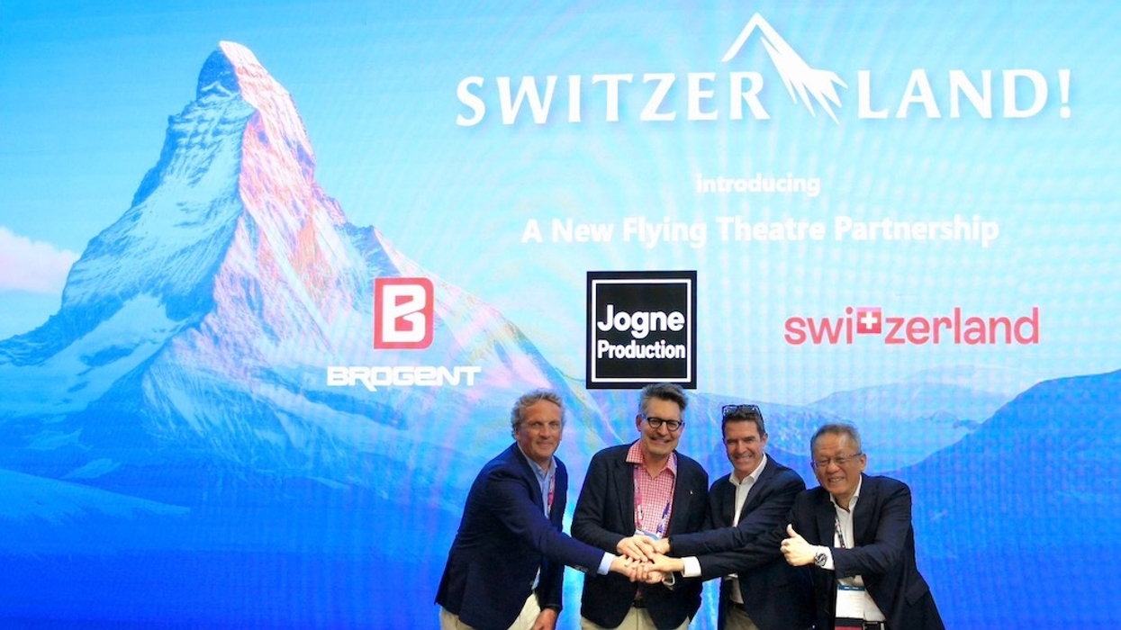 Five men celebrating a Swiss flying theatre partnership, with the Matterhorn in the background.