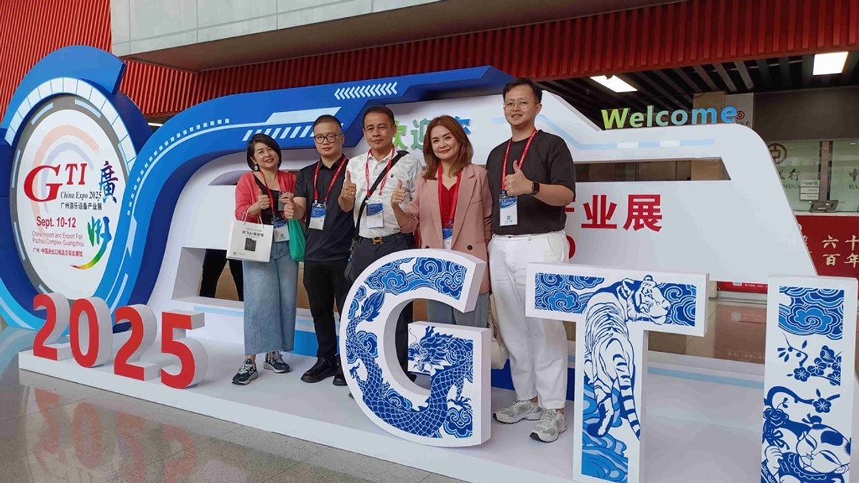 Five people pose at the GTI China Expo 2023, with "2025" in large numbers.