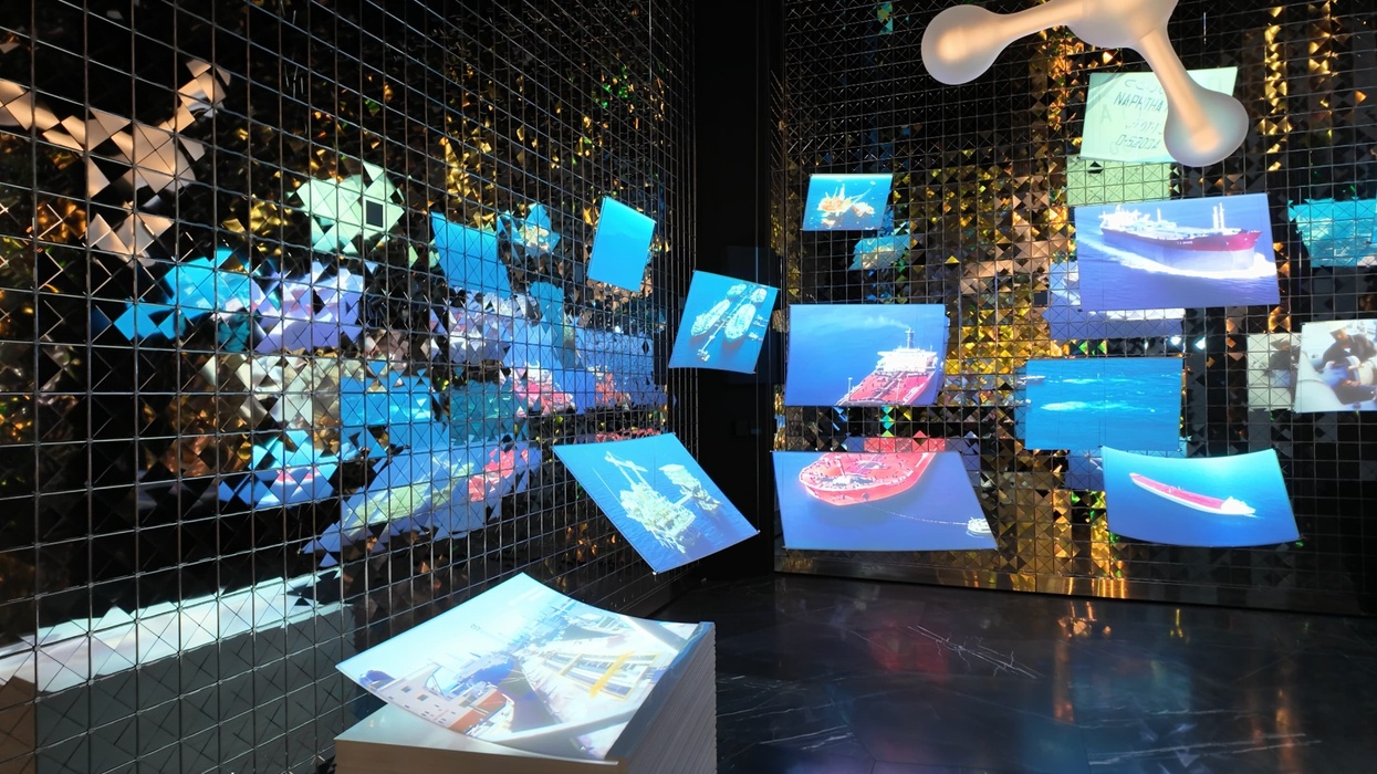 Floating ship images against a mirrored wall, creating a futuristic display.