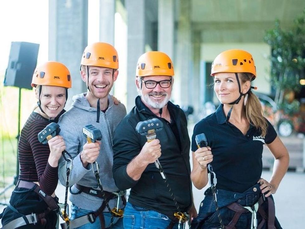 four climbers hold saferoller hardware at aspen-antwerpen