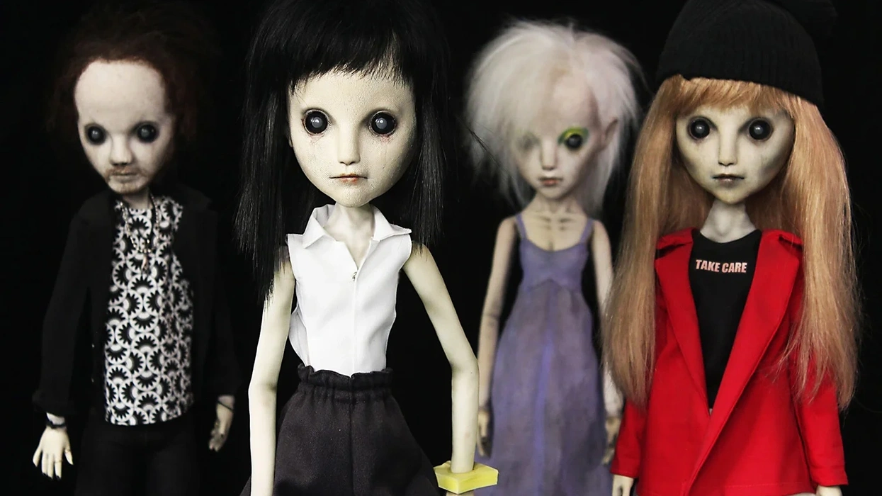 Four eerie, gothic dolls with large dark eyes, unique outfits, and distinctive hairstyles.