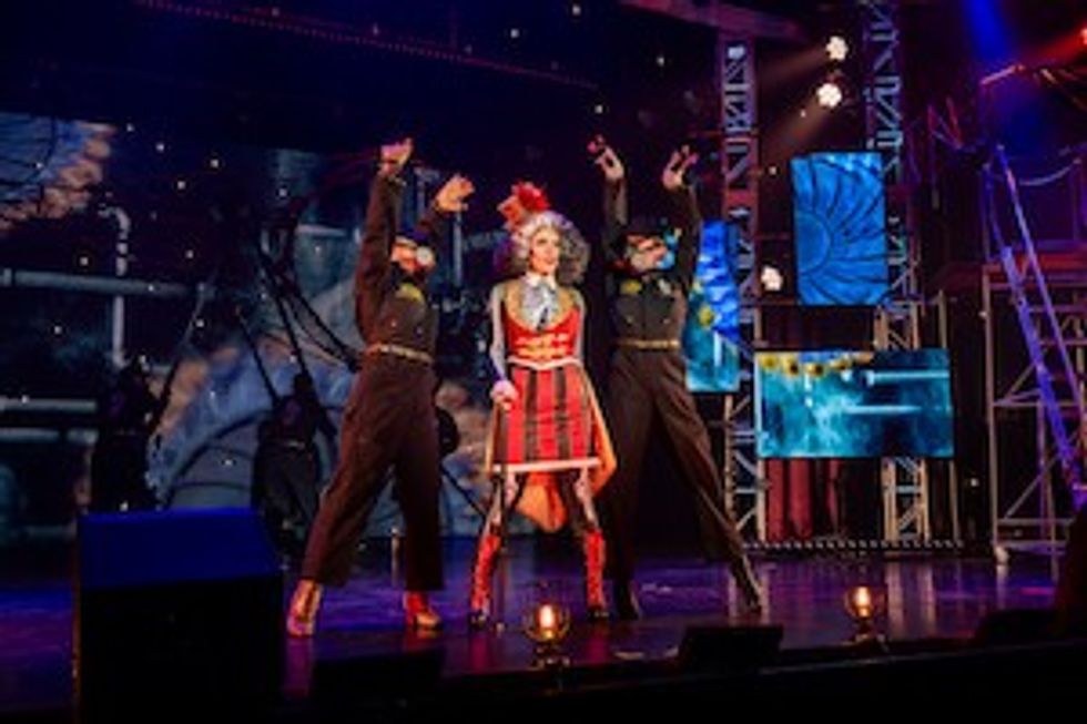 Freakshow host with two performers in Gas Masks