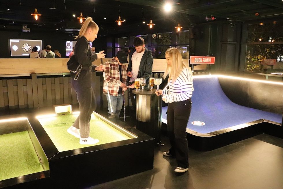 Friends playing at Par 59 competitive socialising