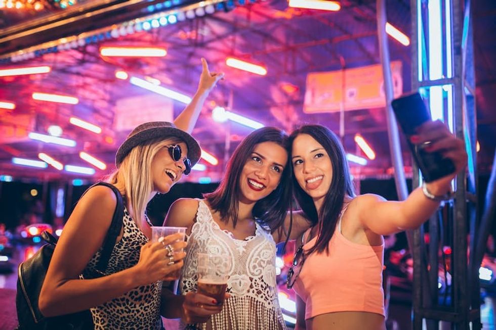 friends taking selfie in arcade Revitalising city centres
