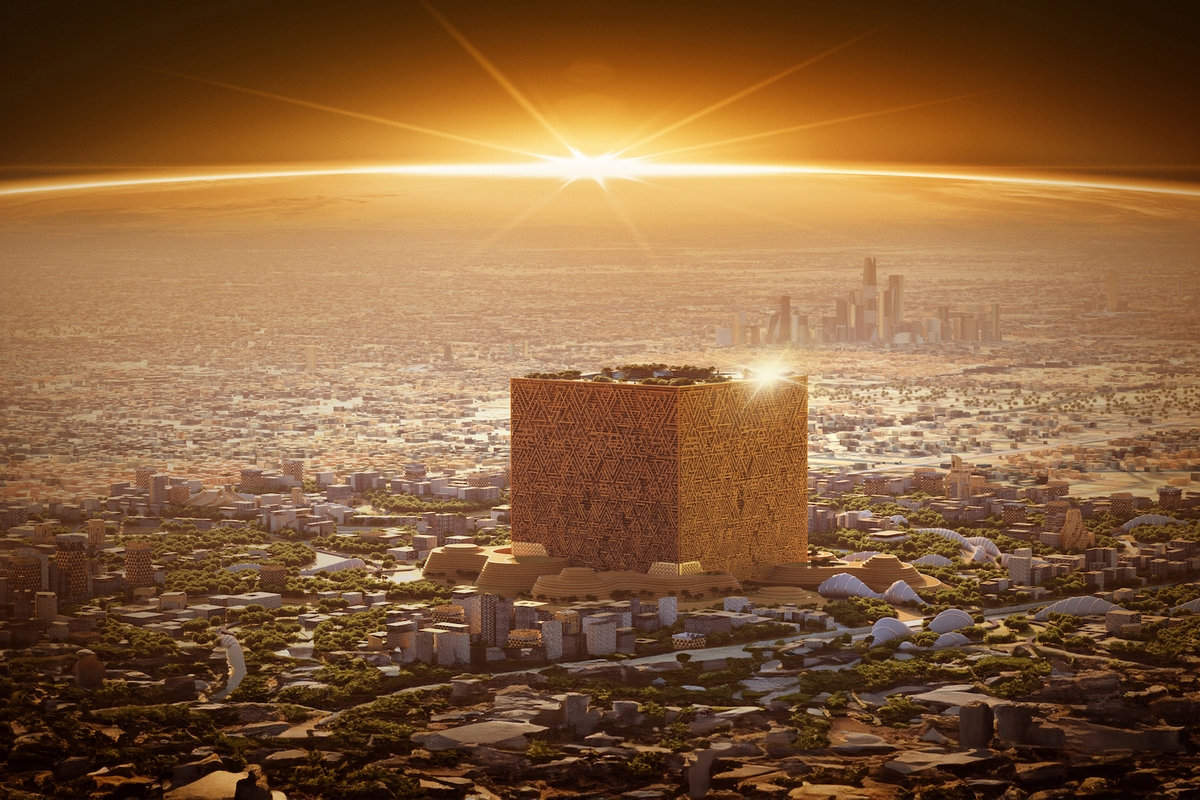 Futuristic cityscape with a large cube building at sunrise.