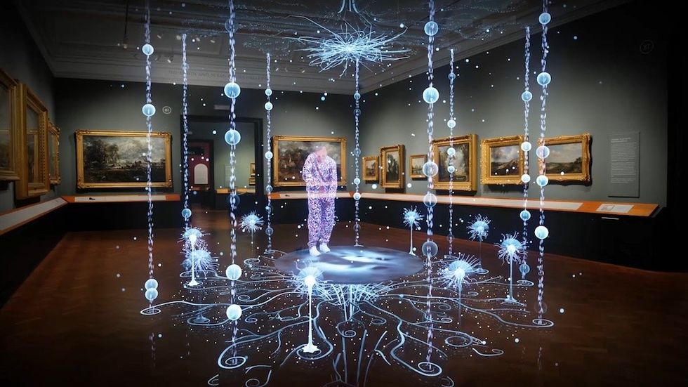 Futuristic digital art display in a gallery, featuring glowing neural network visuals. Sonzai and V&A virtual human