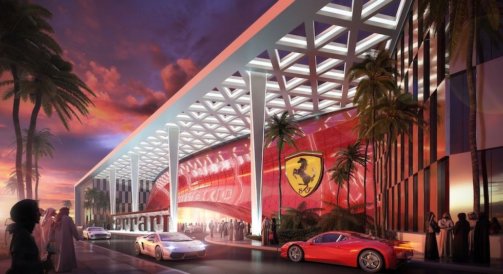 Futuristic Ferrari showroom with cars, palm trees, and sunset lighting.