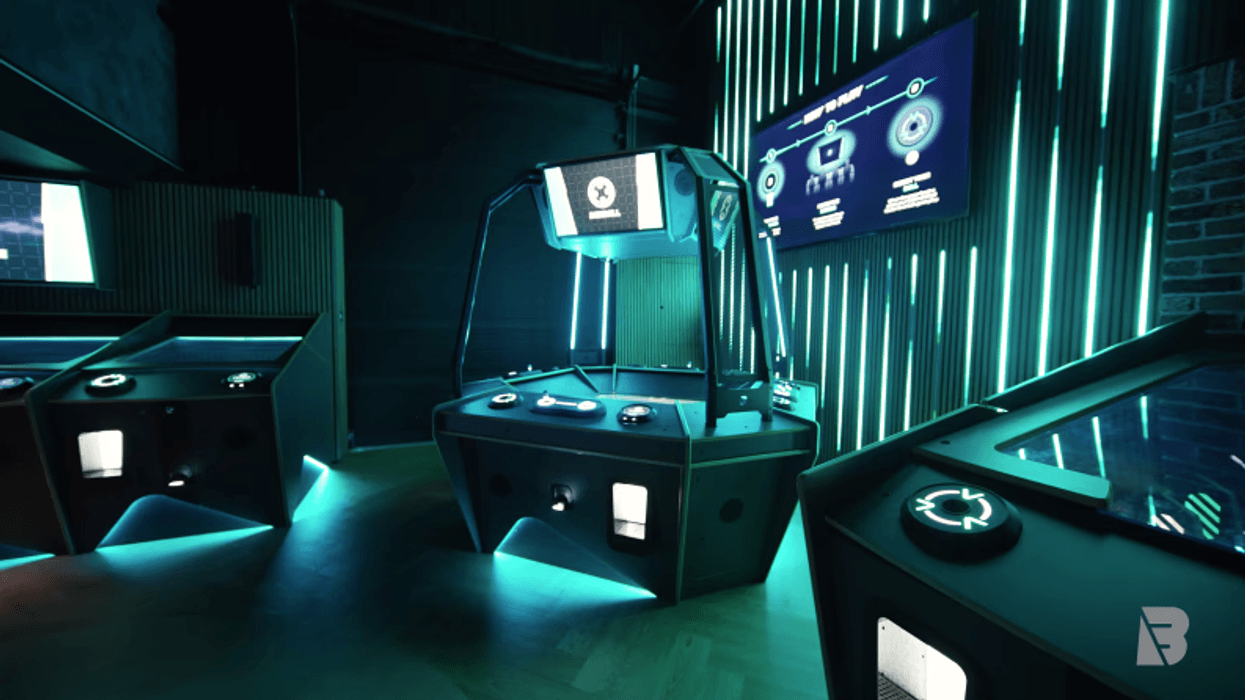 Futuristic gaming room with neon lights and interactive consoles.