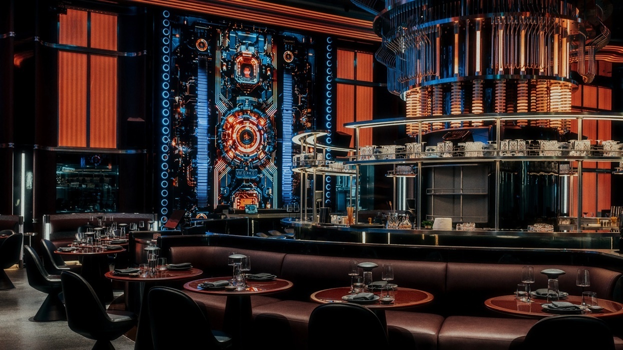 Futuristic restaurant interior with sci-fi decor and circular booths.