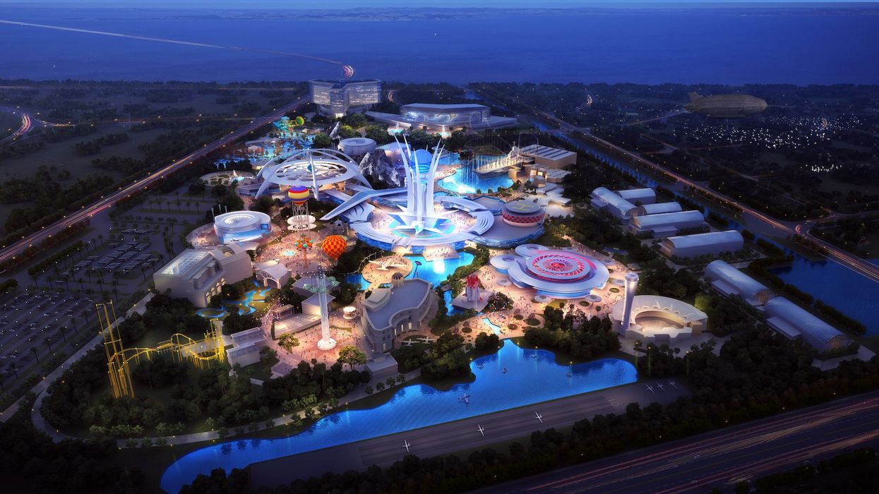 Futuristic theme park at night, with glowing rides and colorful lights, surrounded by greenery.