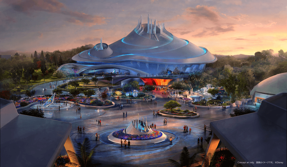 Futuristic theme park plaza with a domed spaceship-like building at sunset.