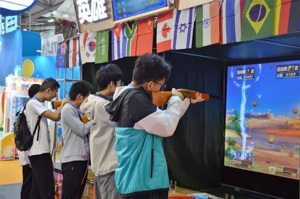Games and Amusement Fair 2018 Attendees at rifle shooting game