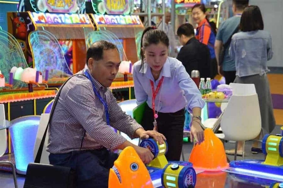 Games and Amusement Fair 2018 Vendor explains game to attendee