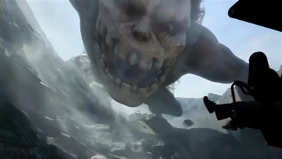 Giant creature lunging toward aircraft in a misty, mountainous landscape.