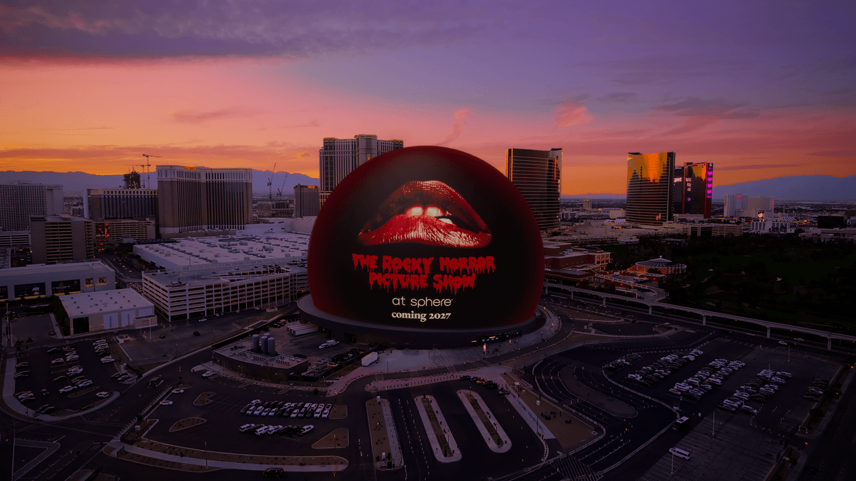 Giant Sphere in Las Vegas displaying "The Rocky Horror Picture Show," in cityscape at sunset.